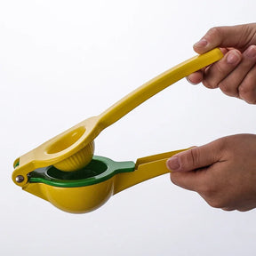 handheld tool for squeezing lemons with two bowls